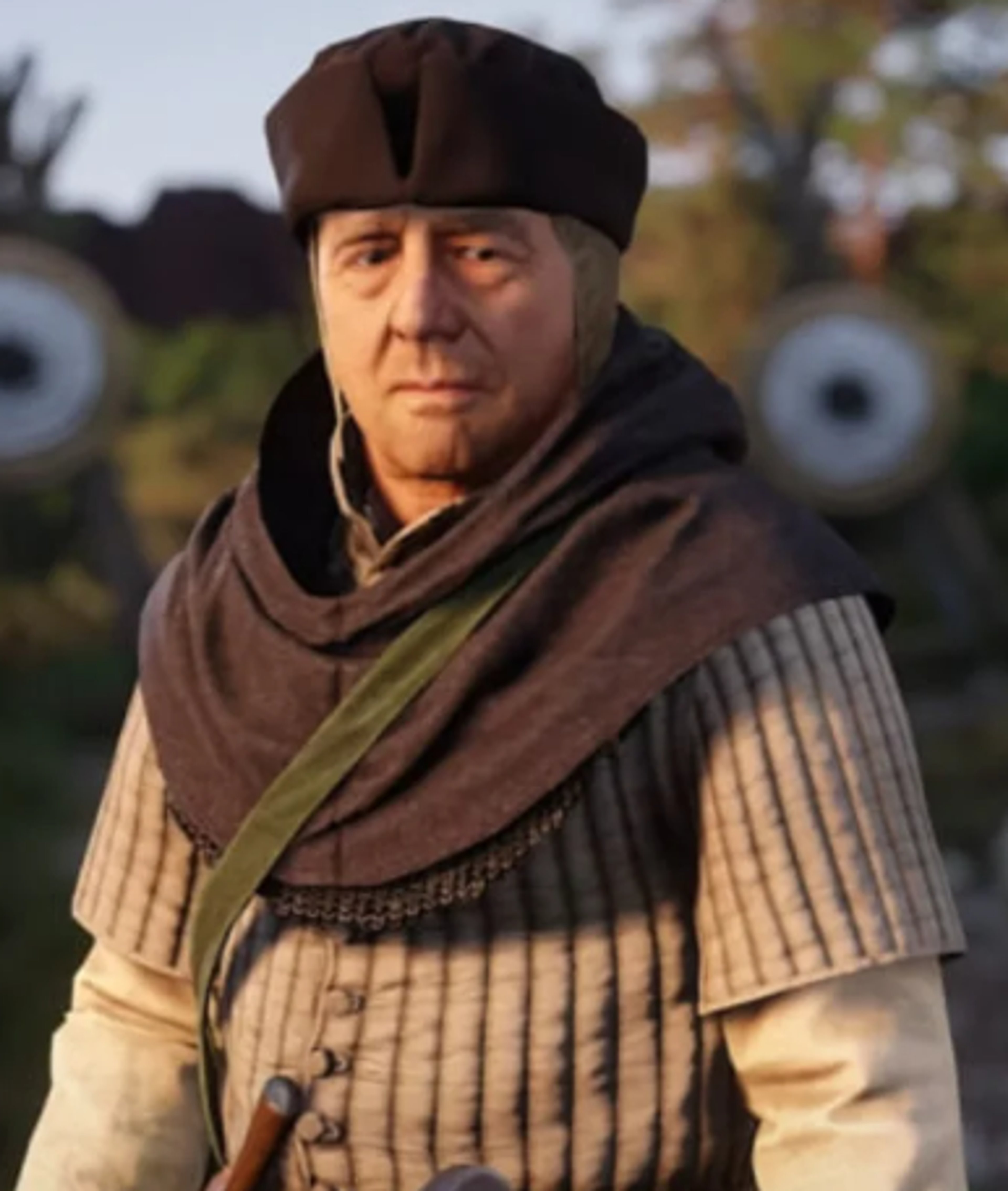 An older man in a brown robe and hat with a serious expression