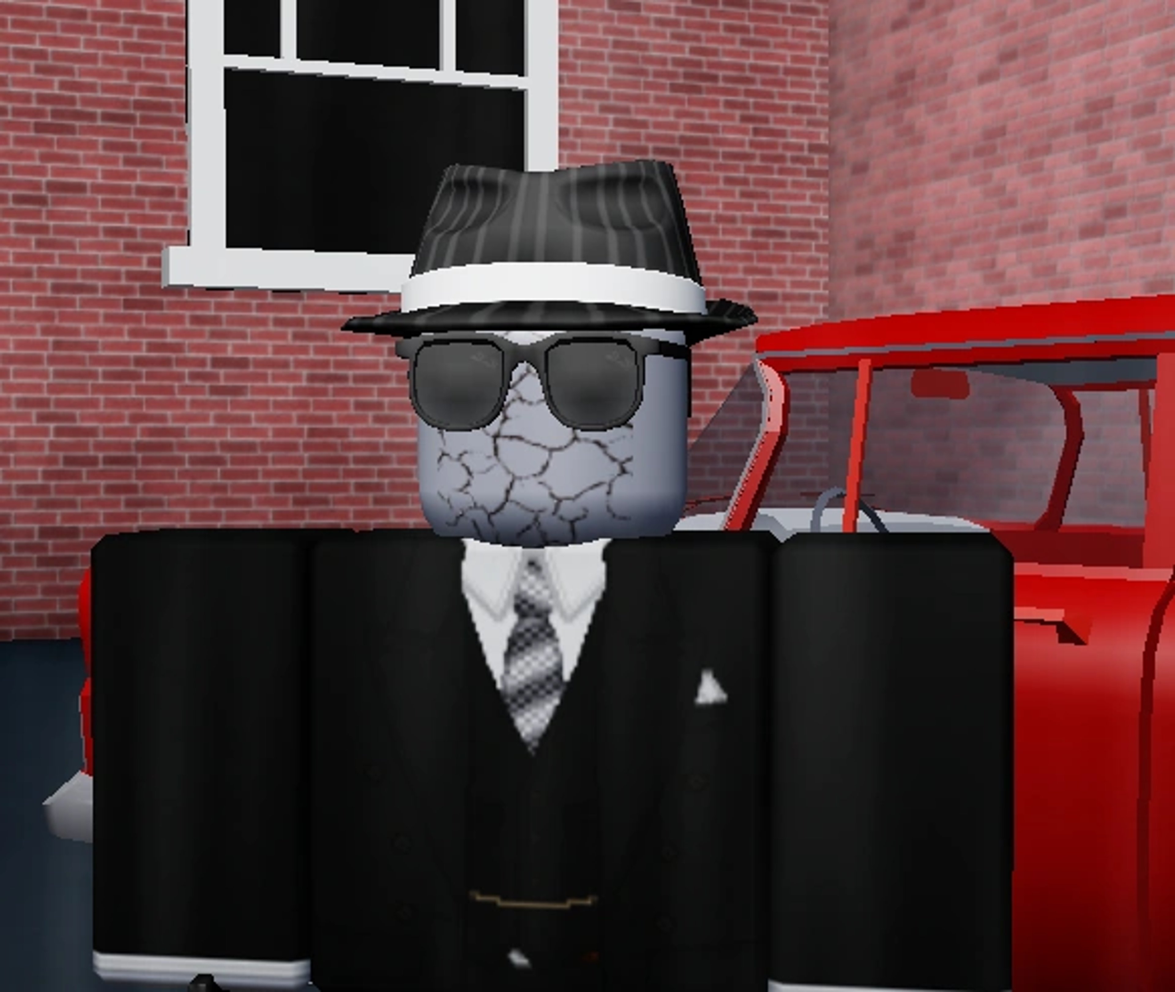 A detailed cartoon character of a mob boss or gangster figure with a cracked, stone-like head, wearing a black suit, hat, and sunglasses.