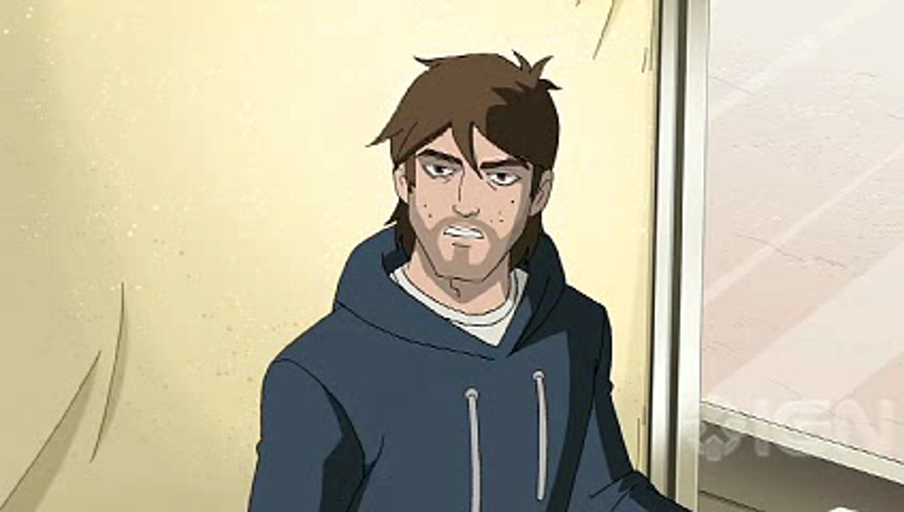 A man with short dark hair wearing a navy blue jacket