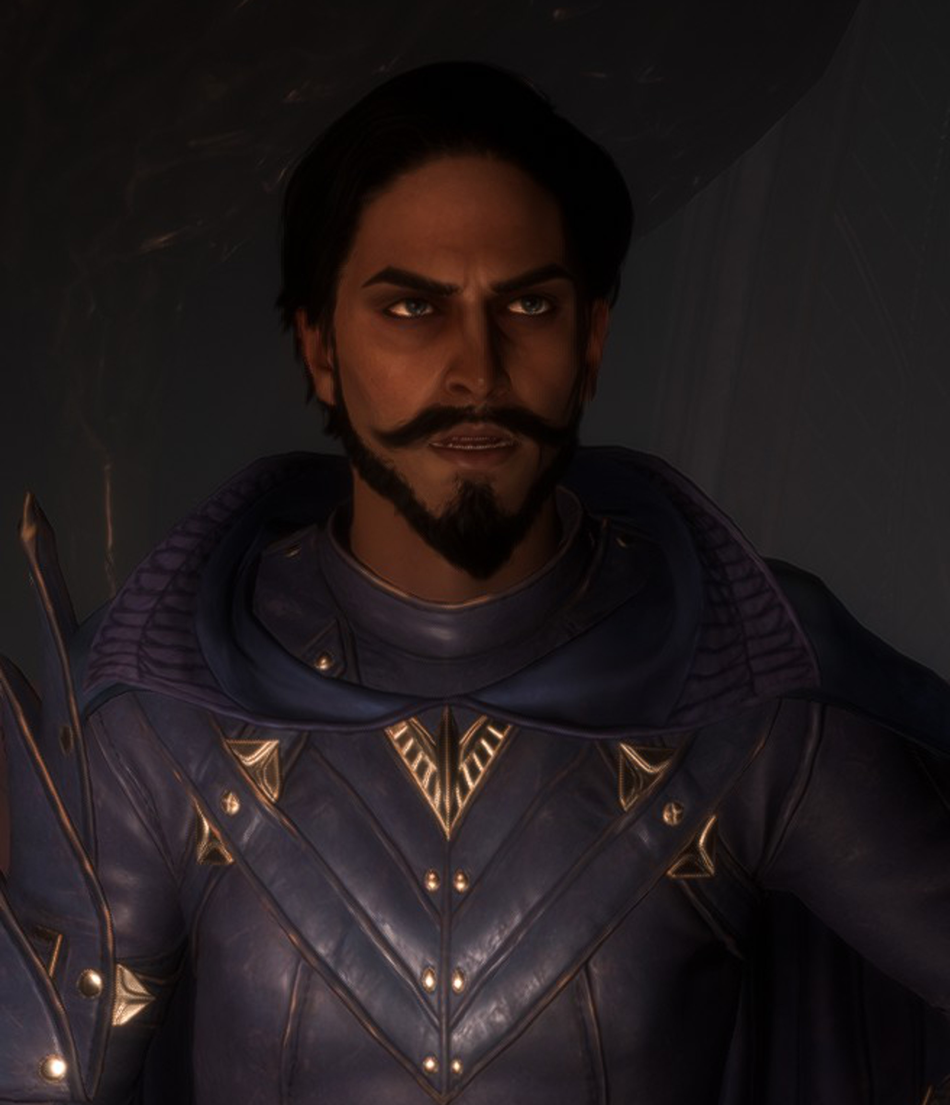 A man with dark hair and a beard wearing a dark purple outfit with gold designs