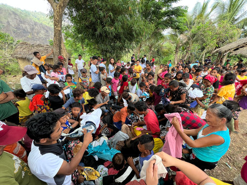 indigenous people receiving clothing donation