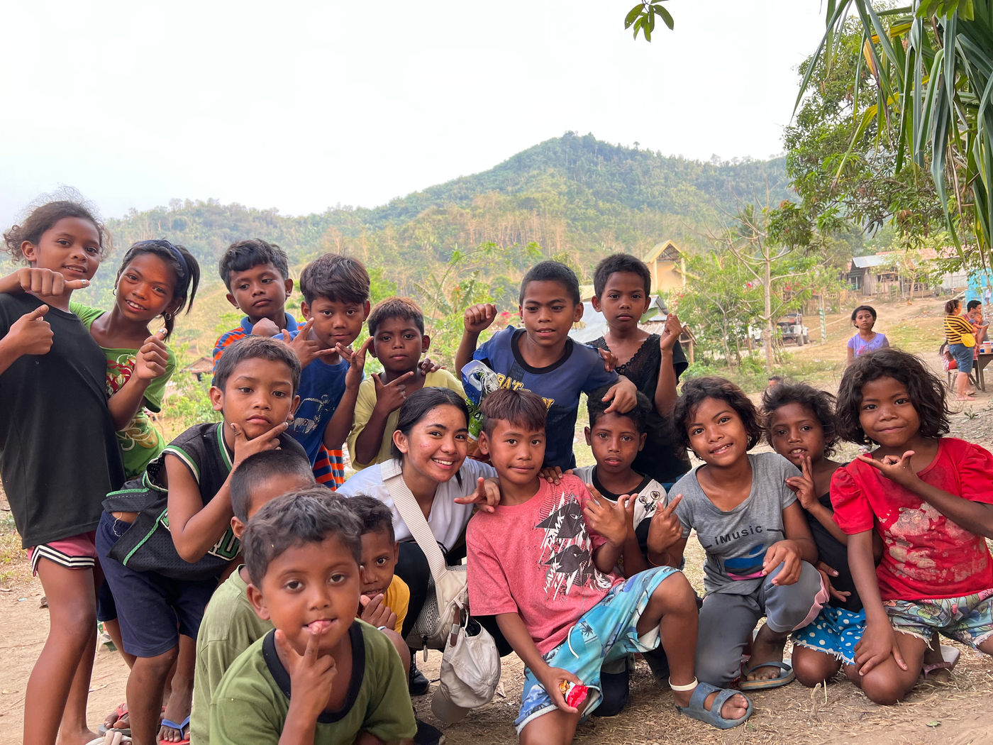 Children of the indigenous people together with one of our tribal missionaries