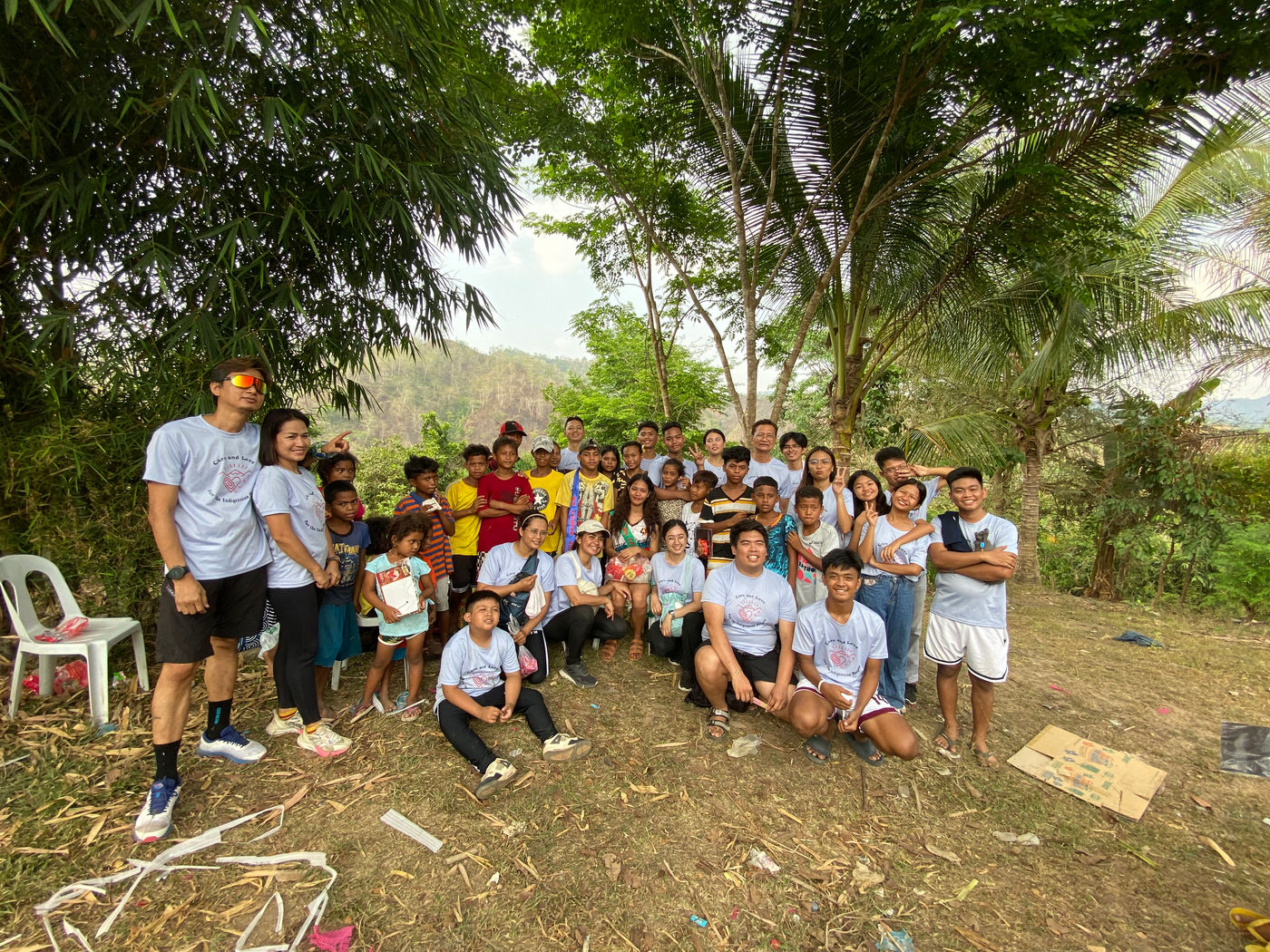 cliporg team group near indigenous people village