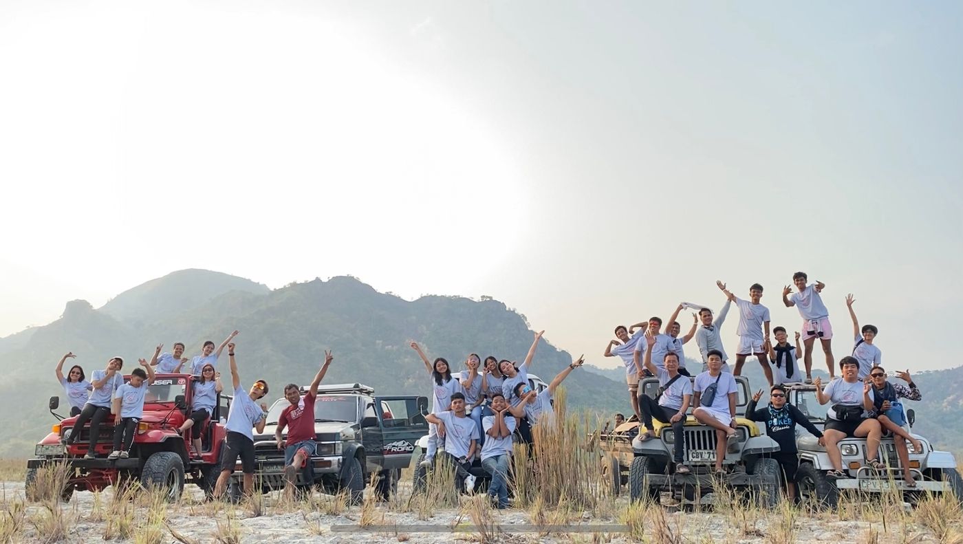 cliporg team on trucks with mountain background