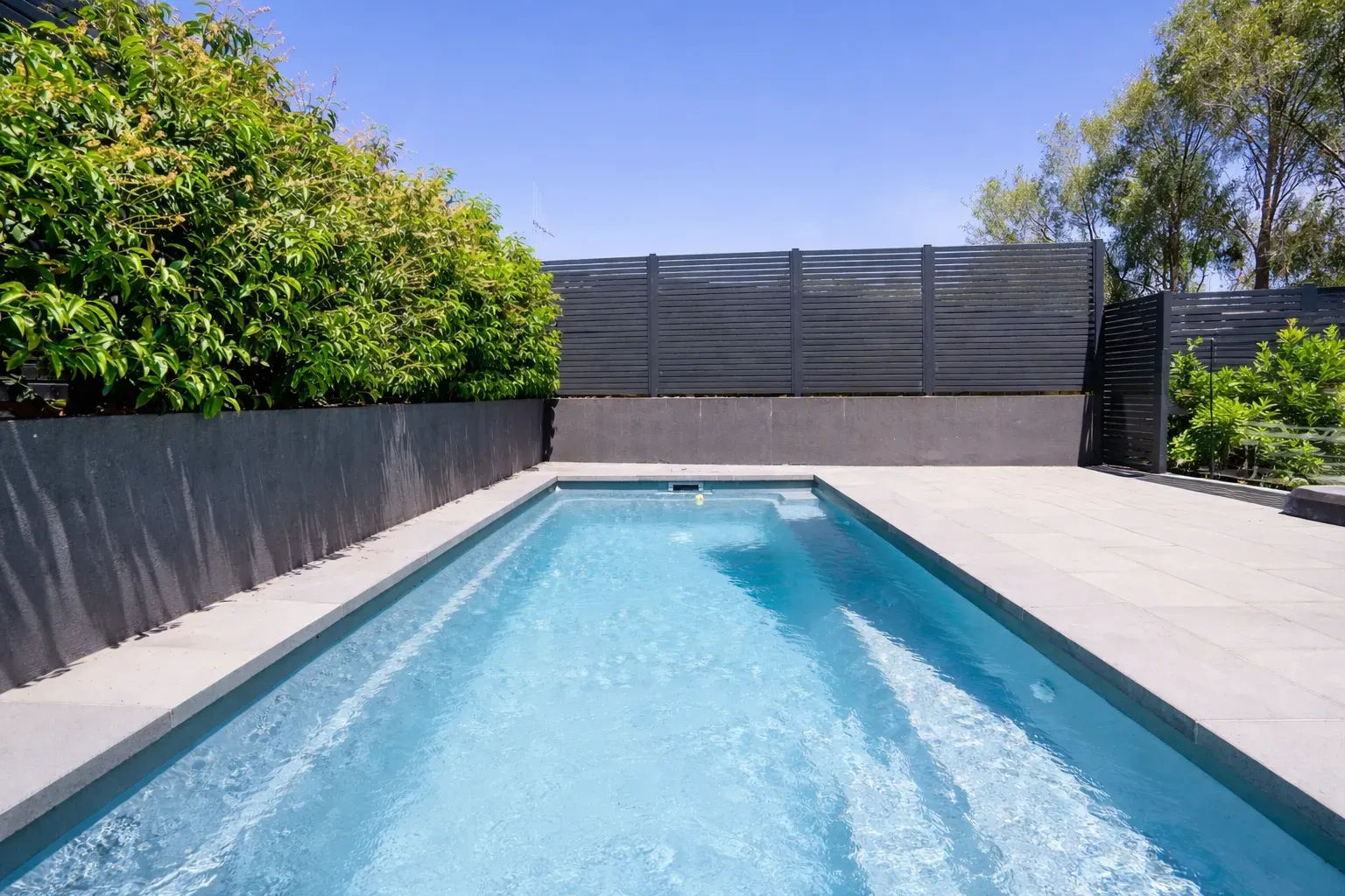 Serene backyard with clear blue pool_converted.webp