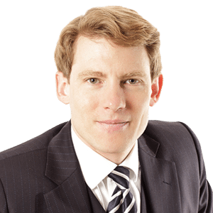 Headshot of Prof. Dr Mark Oliver Mackenrodt, a middle aged man on a simple white background.