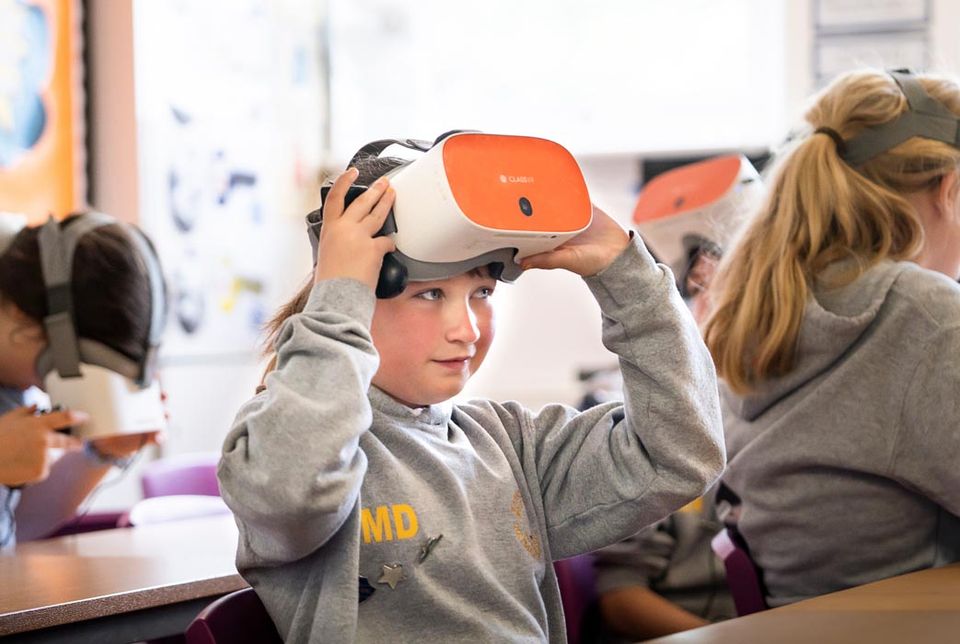 Student wearing a ClassVR headset, experiencing virtual reality in the classroom.