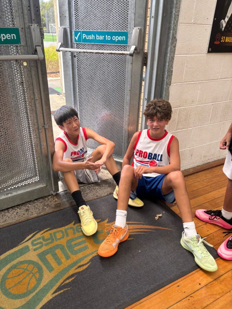 Young basketball players from across Sydney competing in a ProBall Streetball event, showing high-energy games, teams from Mount Druitt and North Sydney, and a full gym of kids playing competitive basketball.