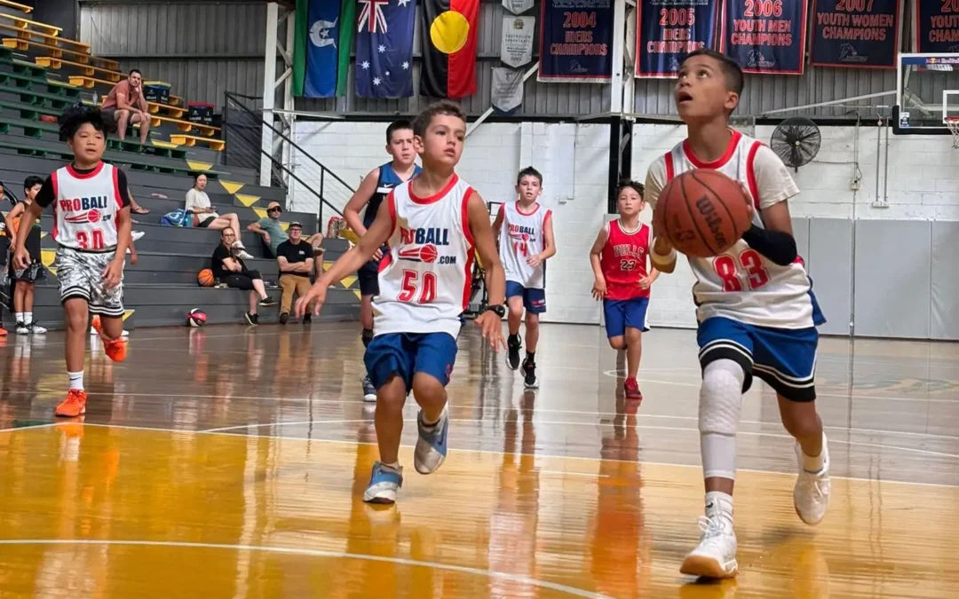 Young basketball players from across Sydney competing in a ProBall Streetball event, showing high-energy games, teams from Mount Druitt and North Sydney, and a full gym of kids playing competitive basketball.