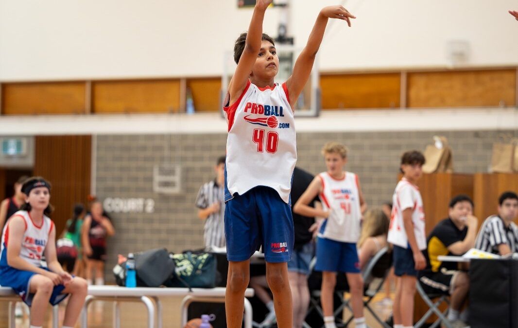 youth basketball player training with focus demonstrating one hour a day basketball development concept