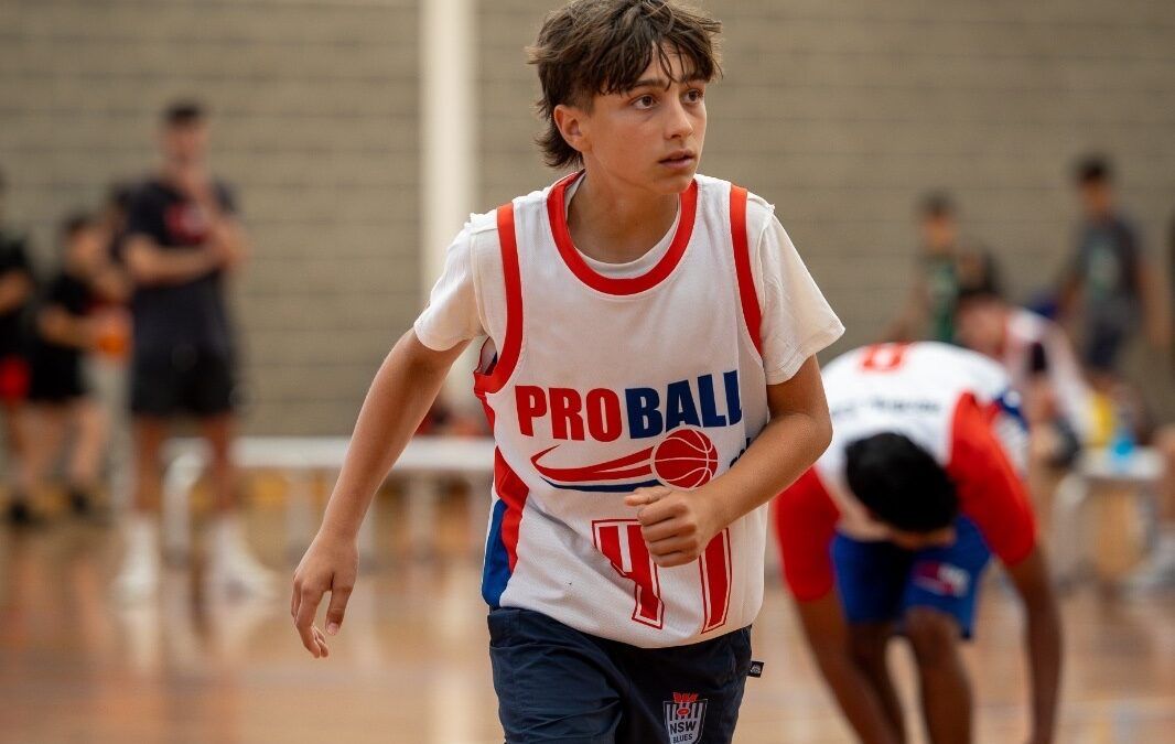 Youth basketball player competing in a game in Sydney, demonstrating athletic performance and in-game movement skills