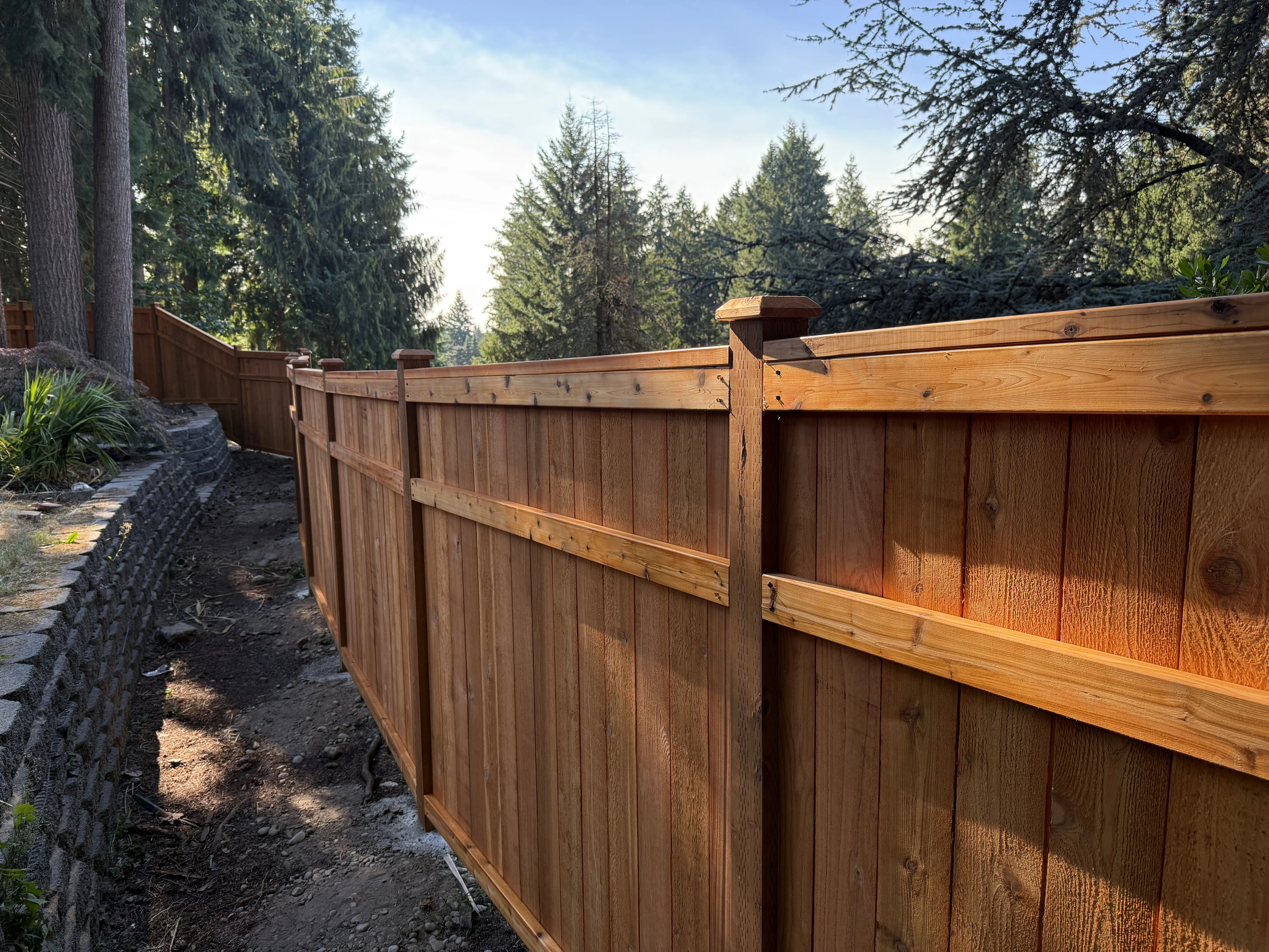 3 rail picture frame fence following terrain in Seattle