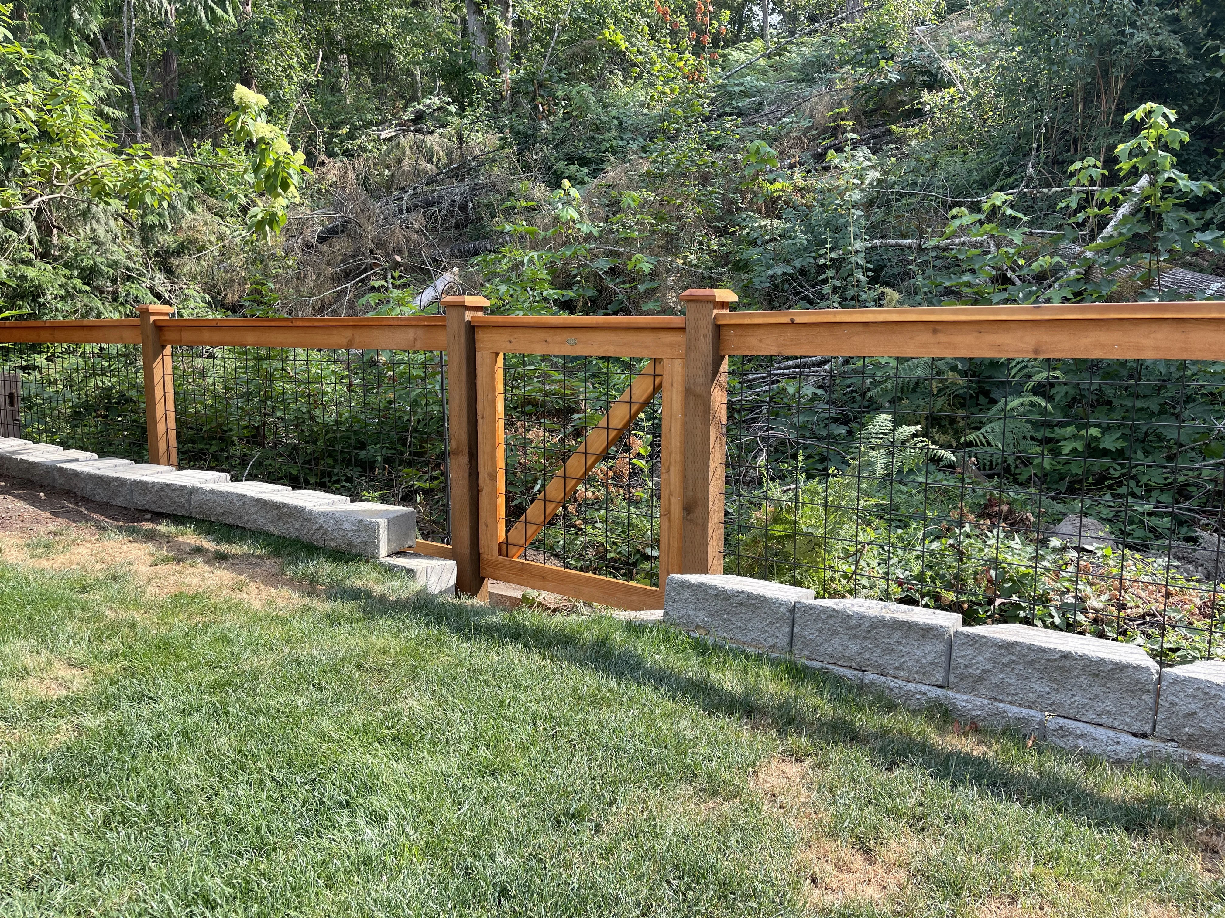 3' Black Hogwire fence with cedar frame on flat terrain
