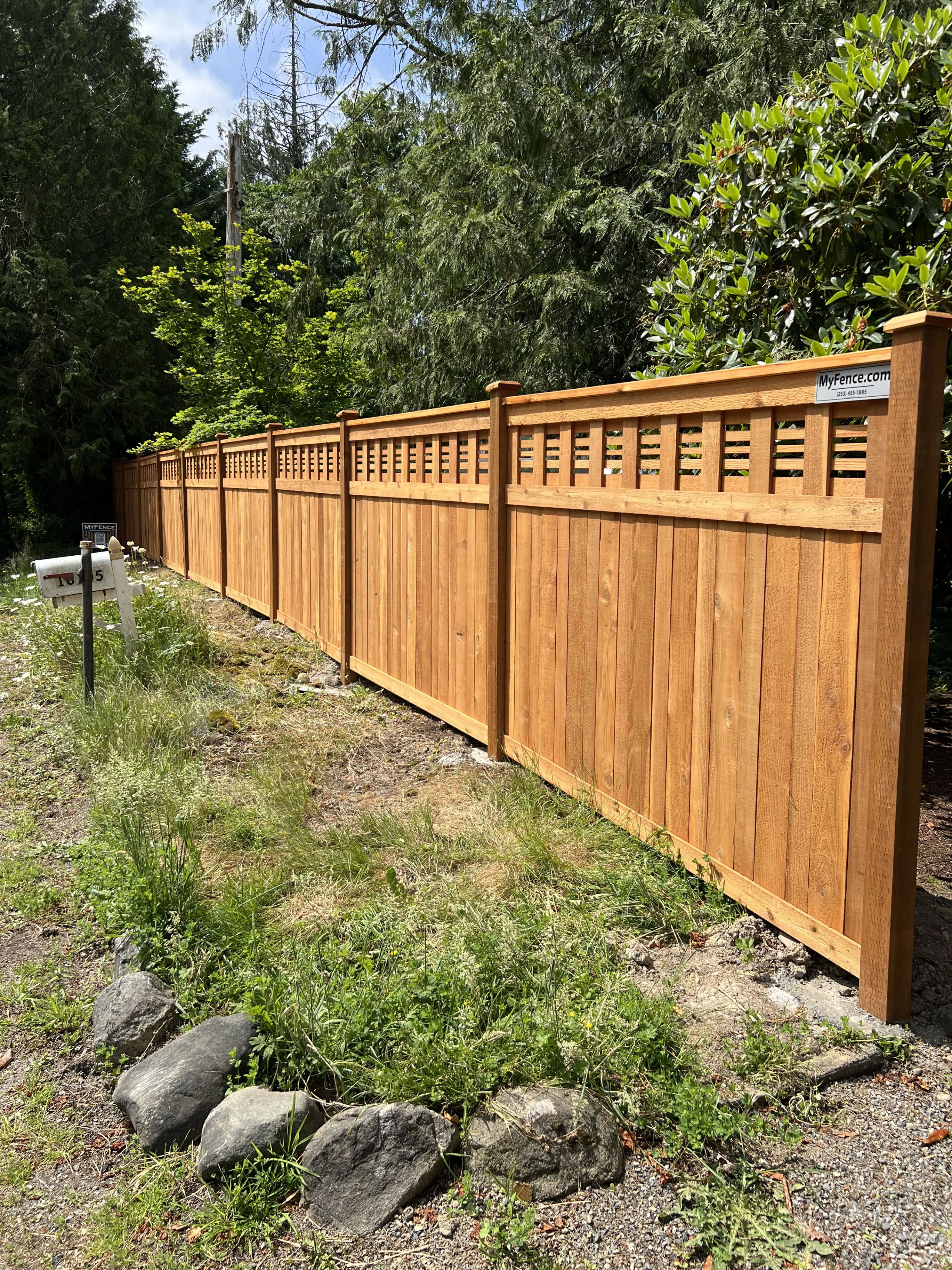 Beautiful horizontal lattice fence with landscaping and professional installation