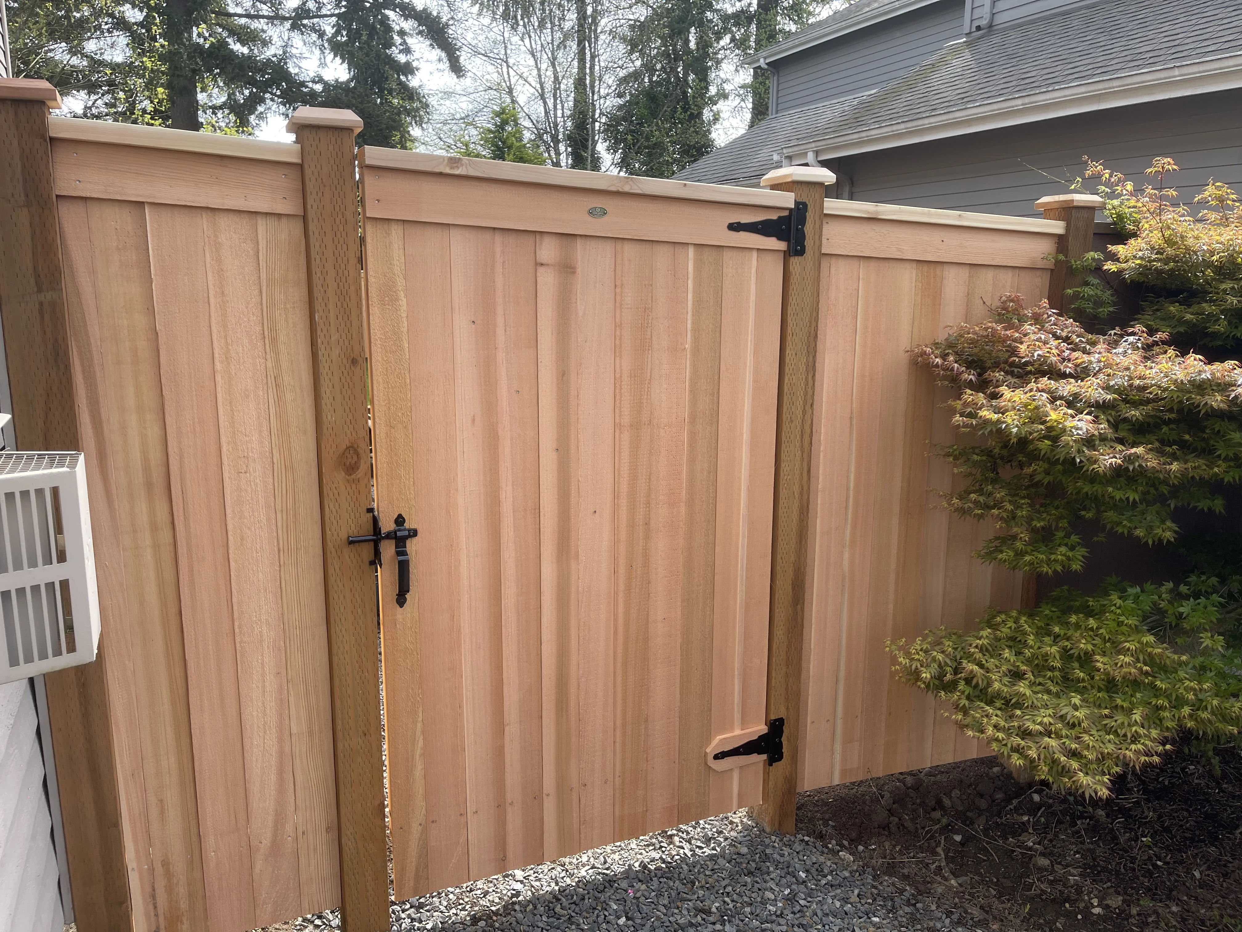 Modified full panel cedar fence with matching gate and stainless steel hardware by MyFence.com