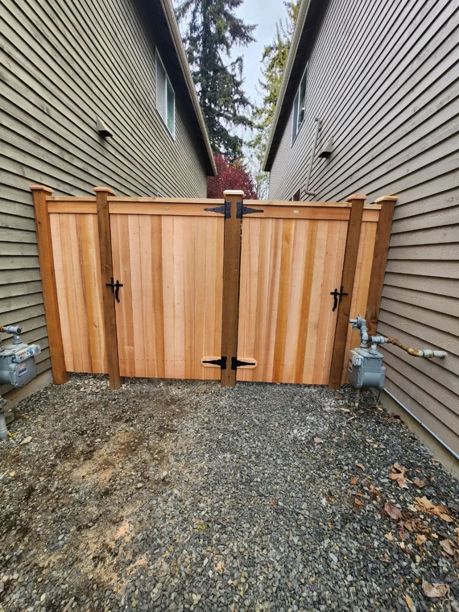 Cedar double gate between two houses on a fence installation in Bothell, WA