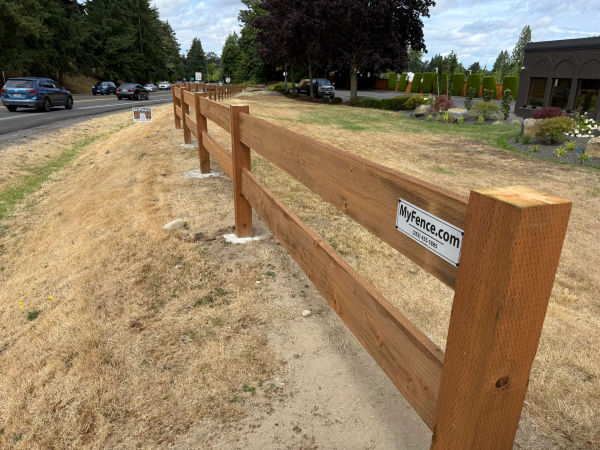2-rail ranch fence with 6x6 pressure treated posts and 2x10 rails in Puyallup, WA by MyFence.com