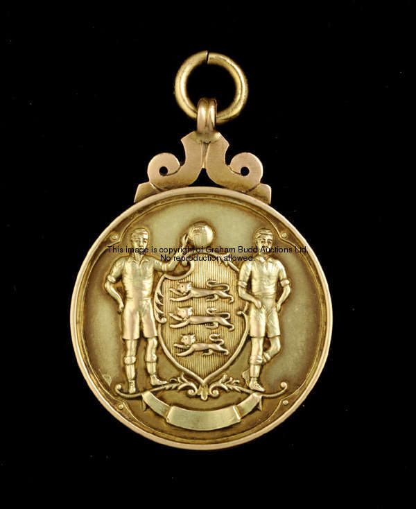 A 9ct. gold FA. Cup winner's medal, 1952, the reverse inscribed THE FOOTBALL ASSOCIATION , CHALLENGE...