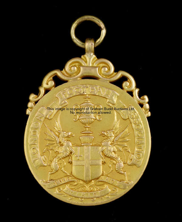 A 15ct. gold medal, inscribed LONDON FOOTBALL ASSOCIATION, WON BY FULHAM F.C., W.B. WALKER, 1909-10