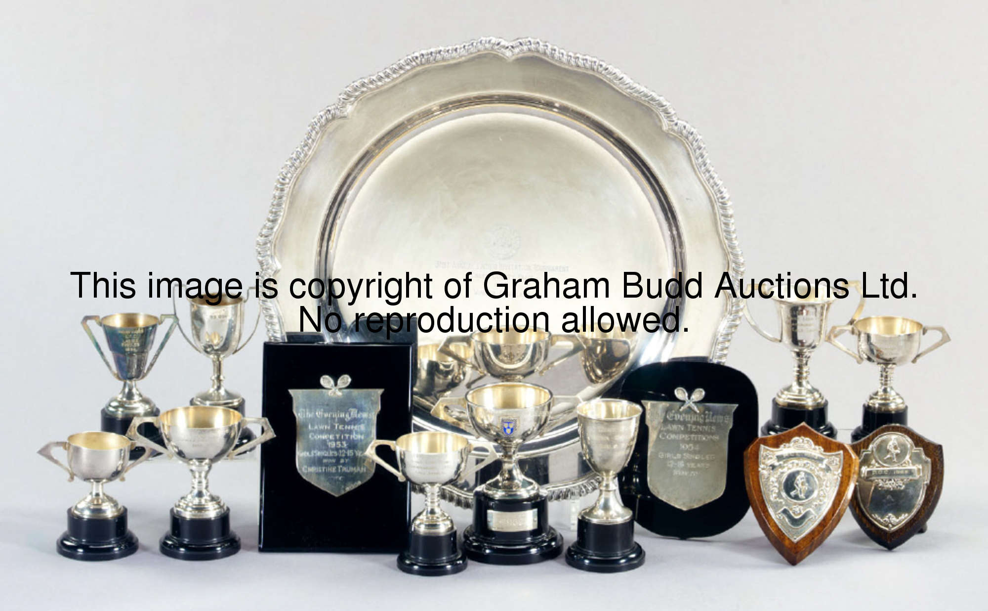 A group of 14 British tennis trophies, comprising a silver Hard Court Championships of Great Britain...