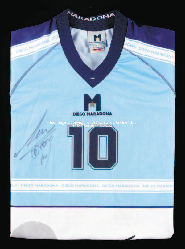 A signed special edition Diego Maradonna jersey, in pale blue & white, double-signed by the Argentin...