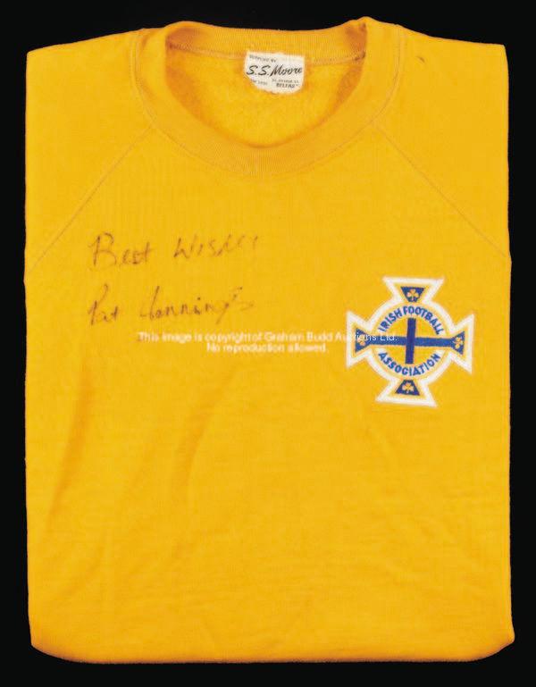 An amber Northern Ireland goalkeeping jersey signed by Pat Jennings, circa 1973, unnumbered, long-sl...