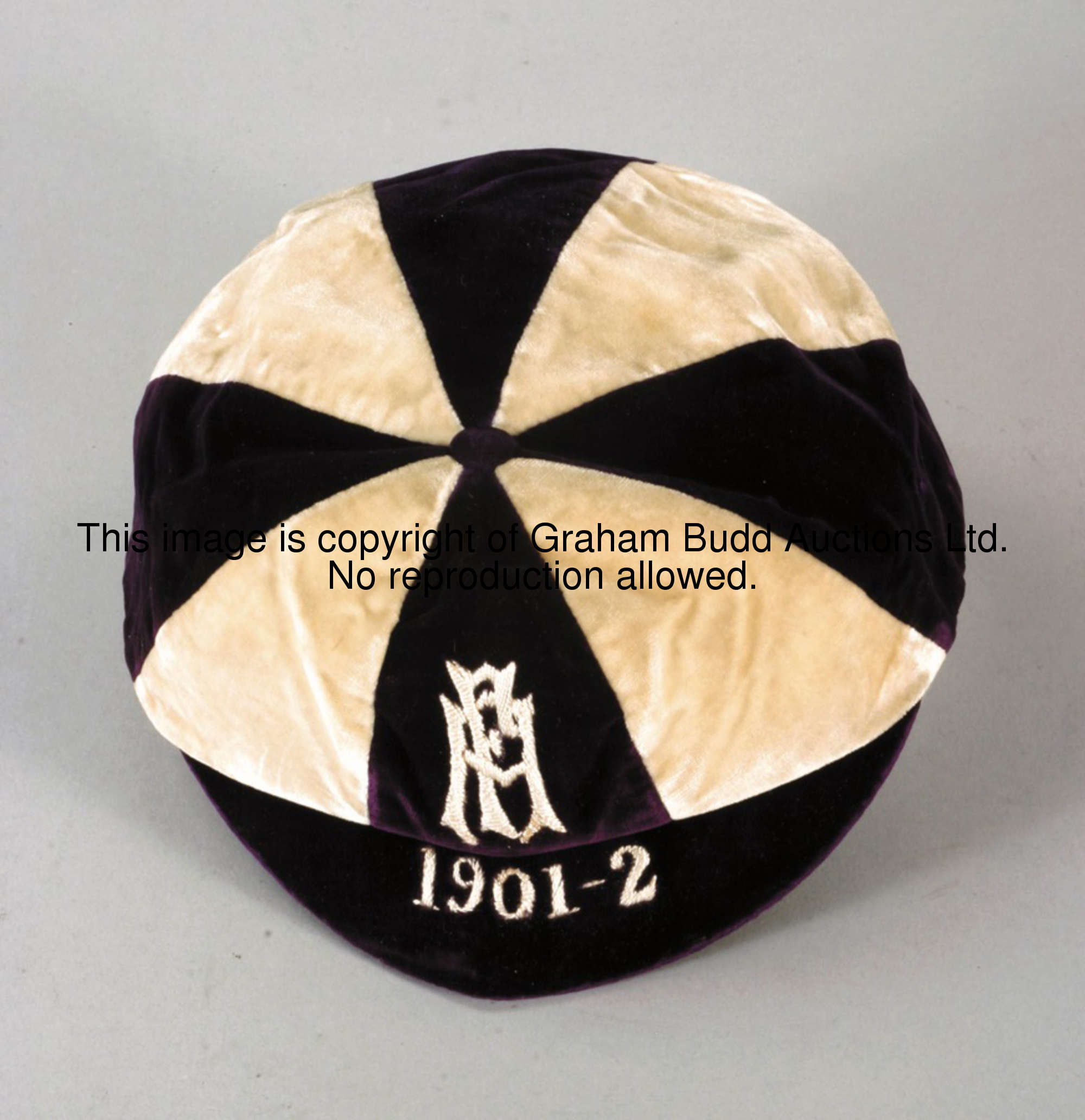 A purple & white F.A. international trial cap, with F.A. monogram and inscribed 1901-2 