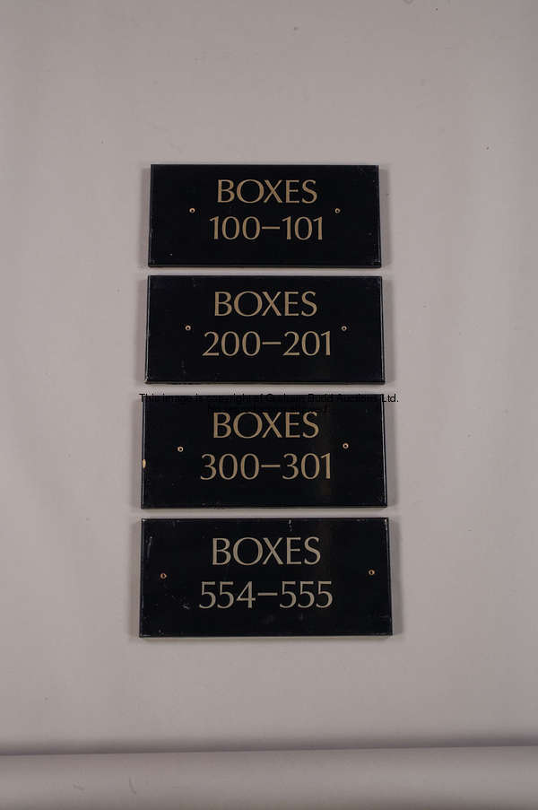 Four Private Box signs, gilt lettering on dark blue painted wood, inscribed BOXES and 100-101, 200-2...