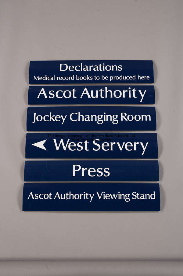Jockeys Changing Room, a convex metal wall sign, white lettering on blue, 14 by 68cm., 5 1.2 by 26 3...