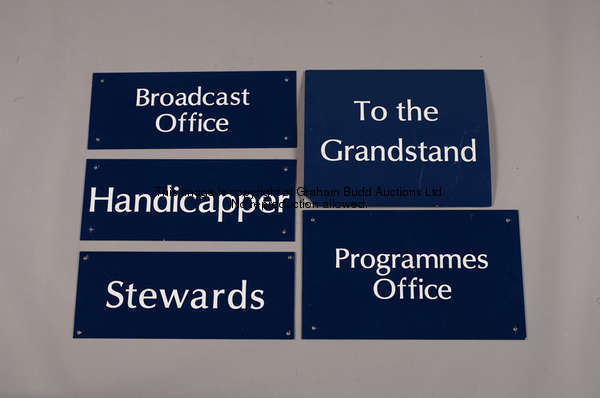 To the Grandstand, convex metal directional sign, white lettering on blue, 35 by 43cm., 13 3/4 by 17...