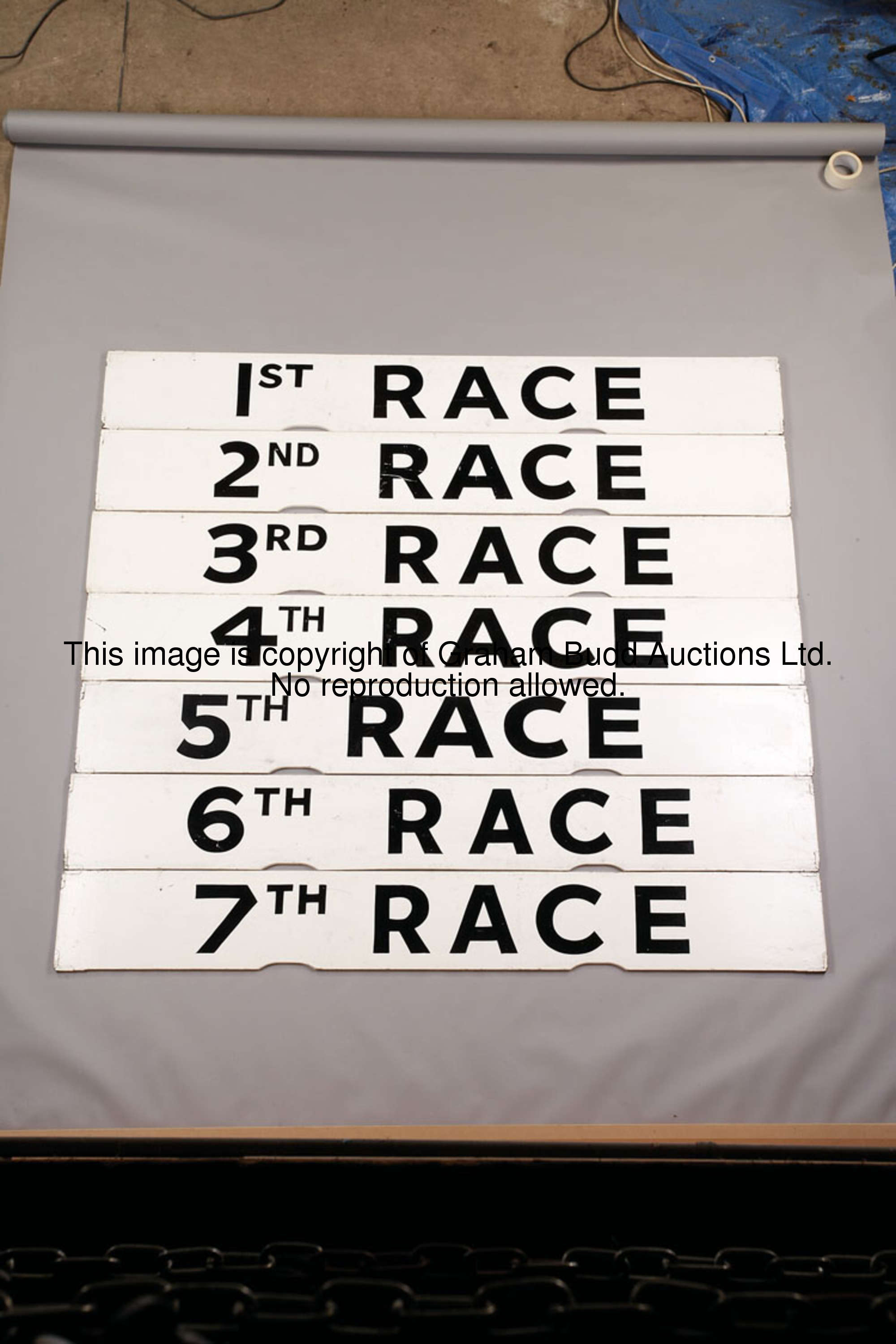 1st Race, white painted wooden Spagnoletti race indicator board with black lettering, 25.5 by 100cm....