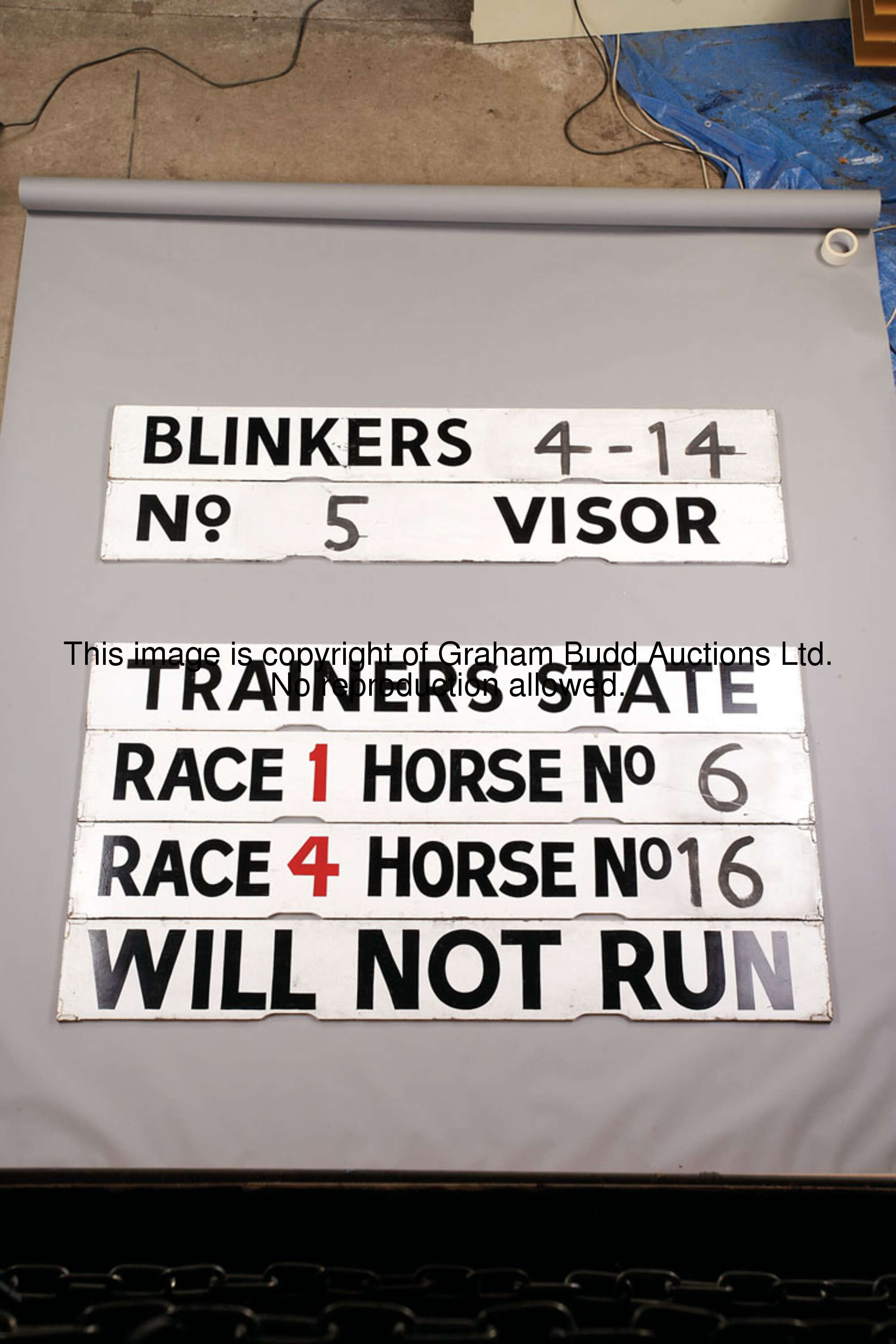 A group of four Spagnoletti boards, when placed vertically read: TRAINERS STATE; RACE 1 HORSE No 6; ...