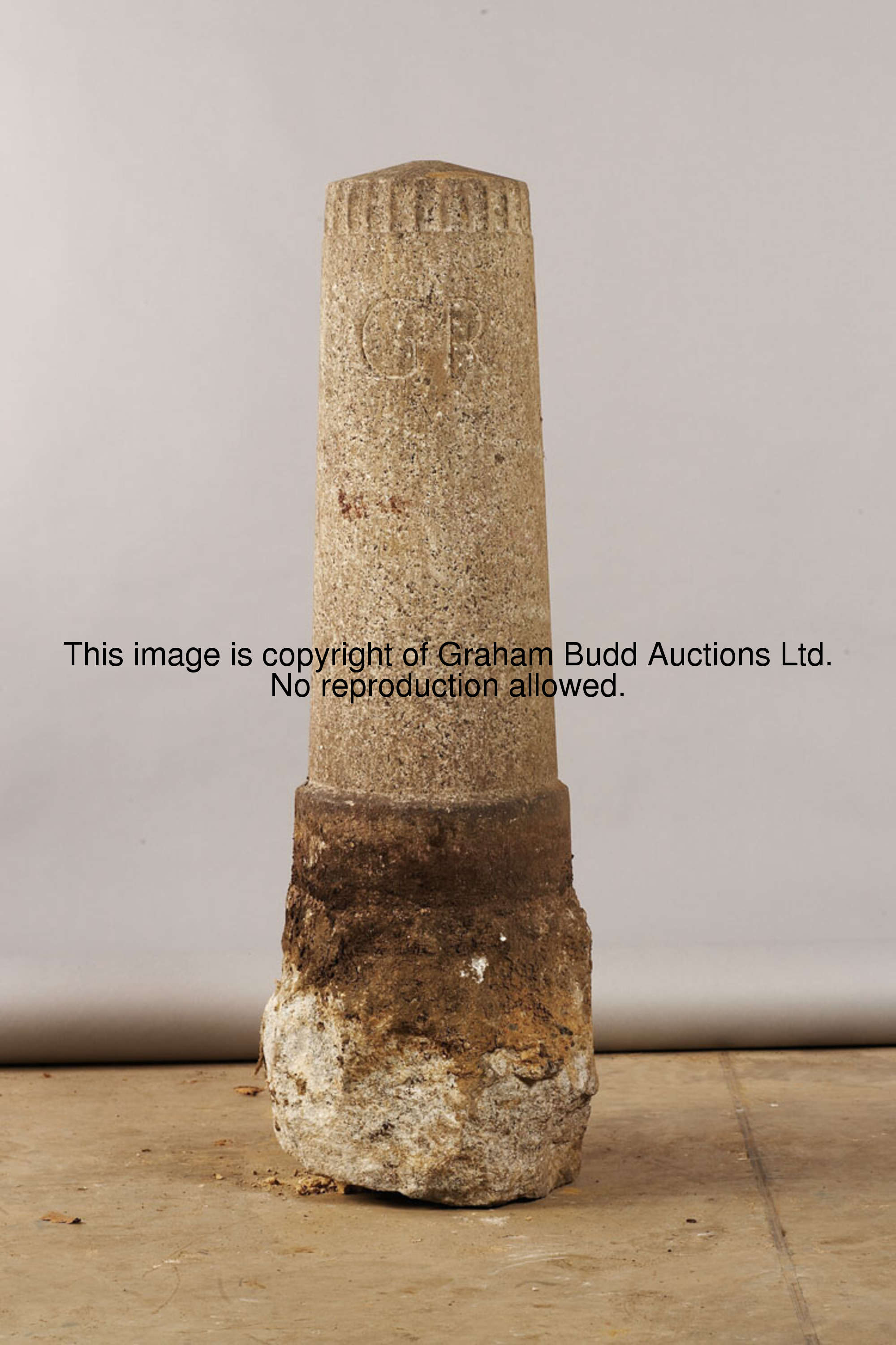 A pair of George V granite bollards, carved GR, V, 102cm., 40in.