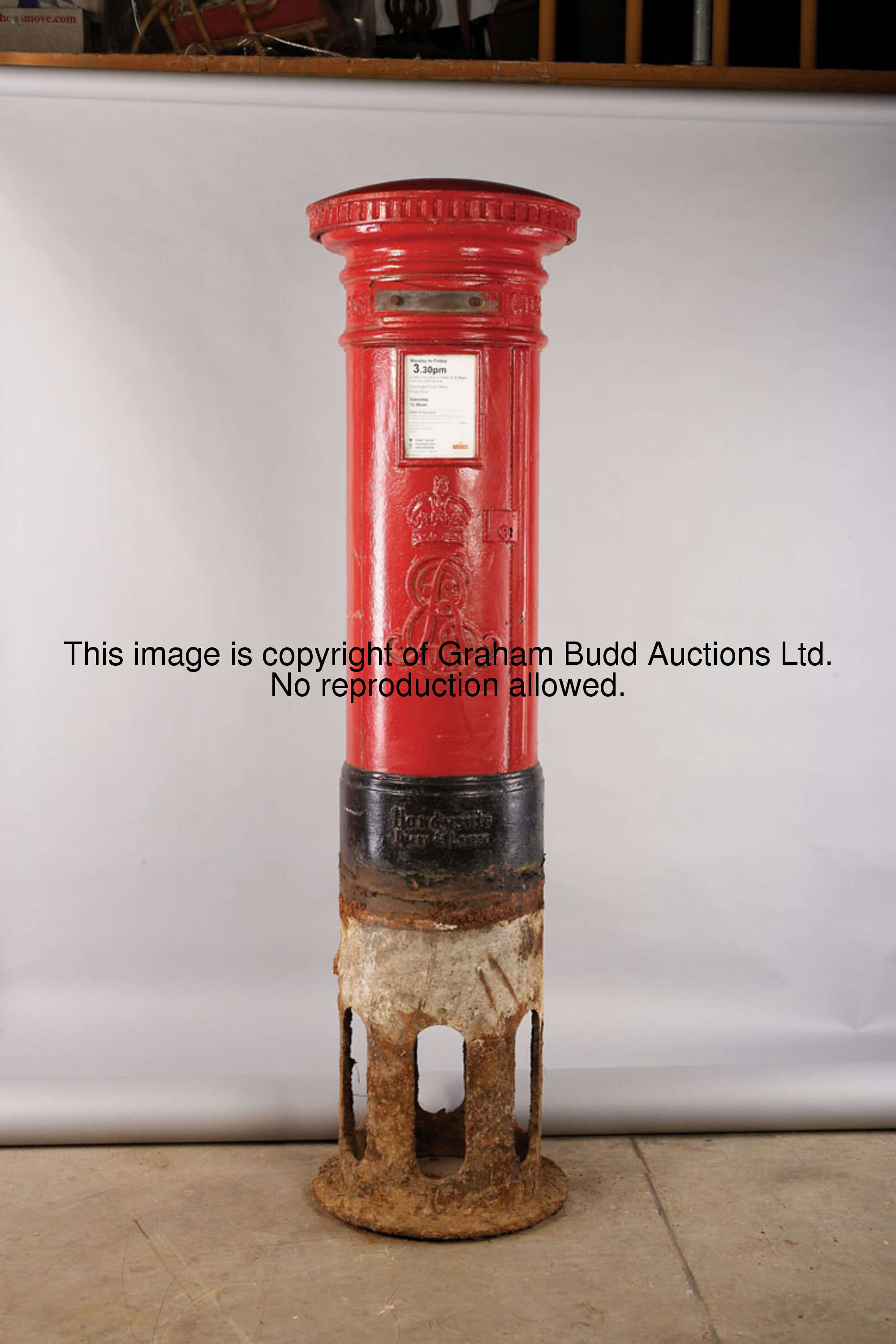 An Edward VII cast iron red pillar post box, with founders's stamp HANDYSIDE, DERBY & LONDON, cast w...