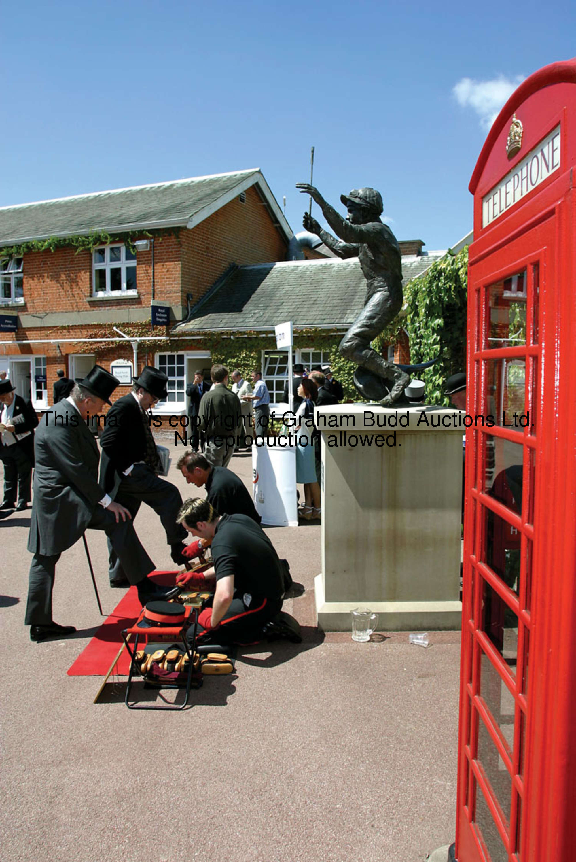 A K6 public telephone box, designed by Sir Gilbert Scott, red painted cast iron, wooden door, glazed...