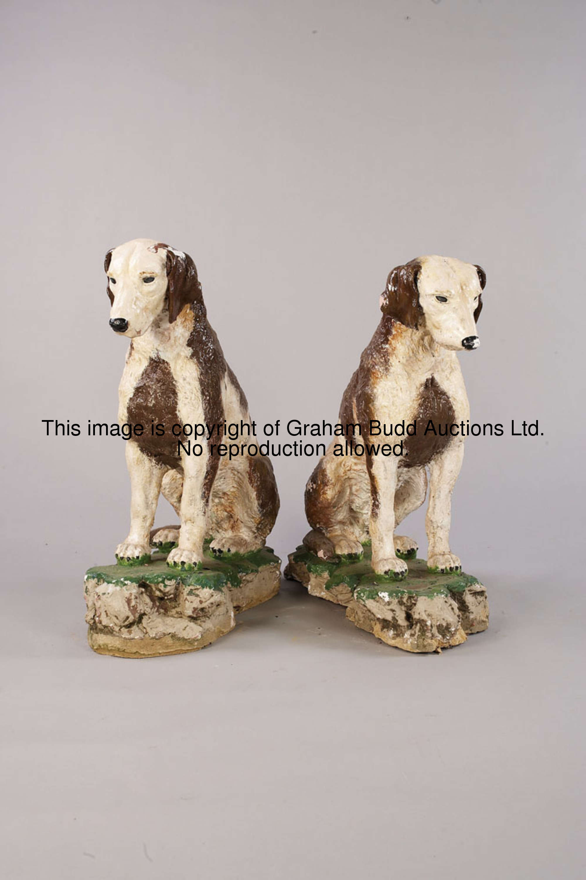 Two models of Buckhounds from the Buckhounds Bar, the large, painted composition hounds set on a nat...