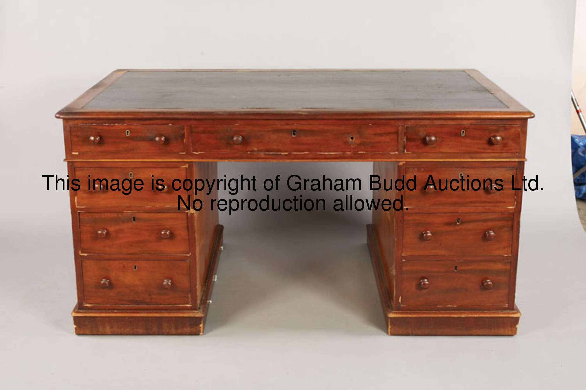 The Clerk of The Course's Office desk, An Edwardian mahogany partners desk, leatherette top, three d...