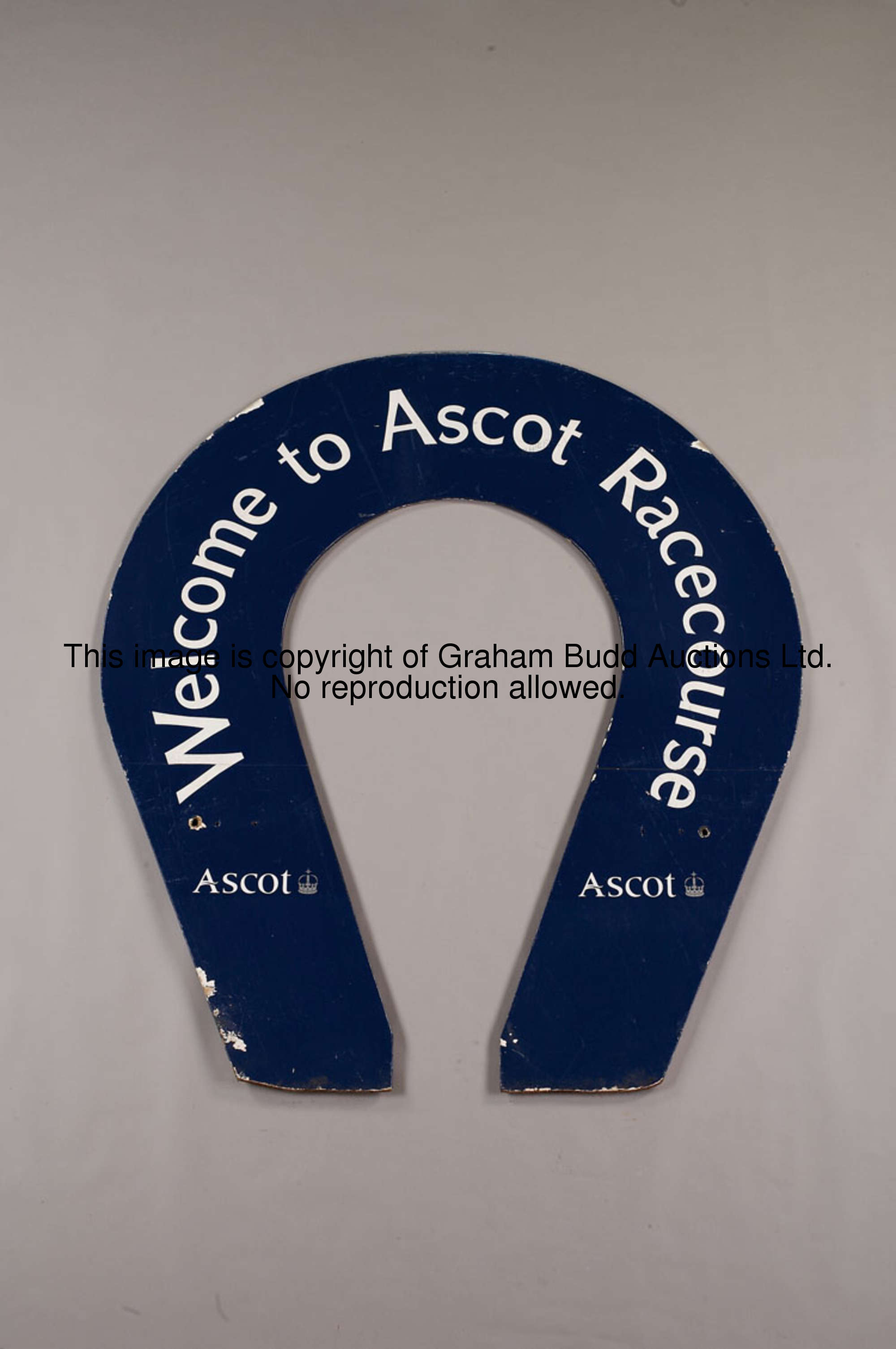 Welcome to Ascot Racecourse winning post backboard horse shoe-shaped, bearing Ascot logo, white lett...