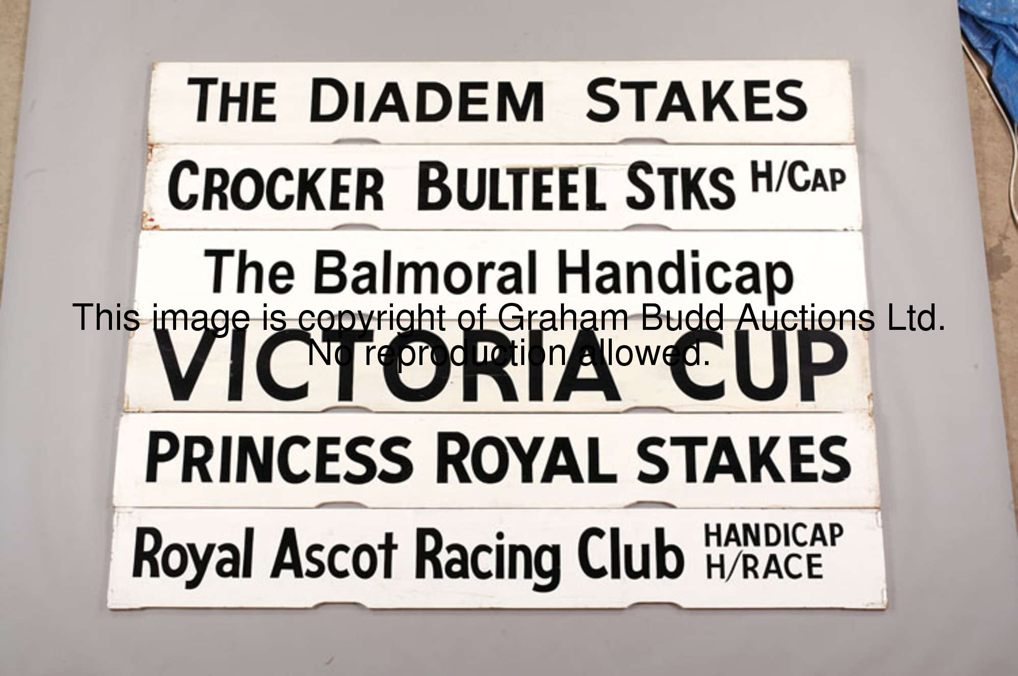 The Balmoral Handicap, a white painted Spagnoletti Ascot race board with black lettering, 25.5 by 10...