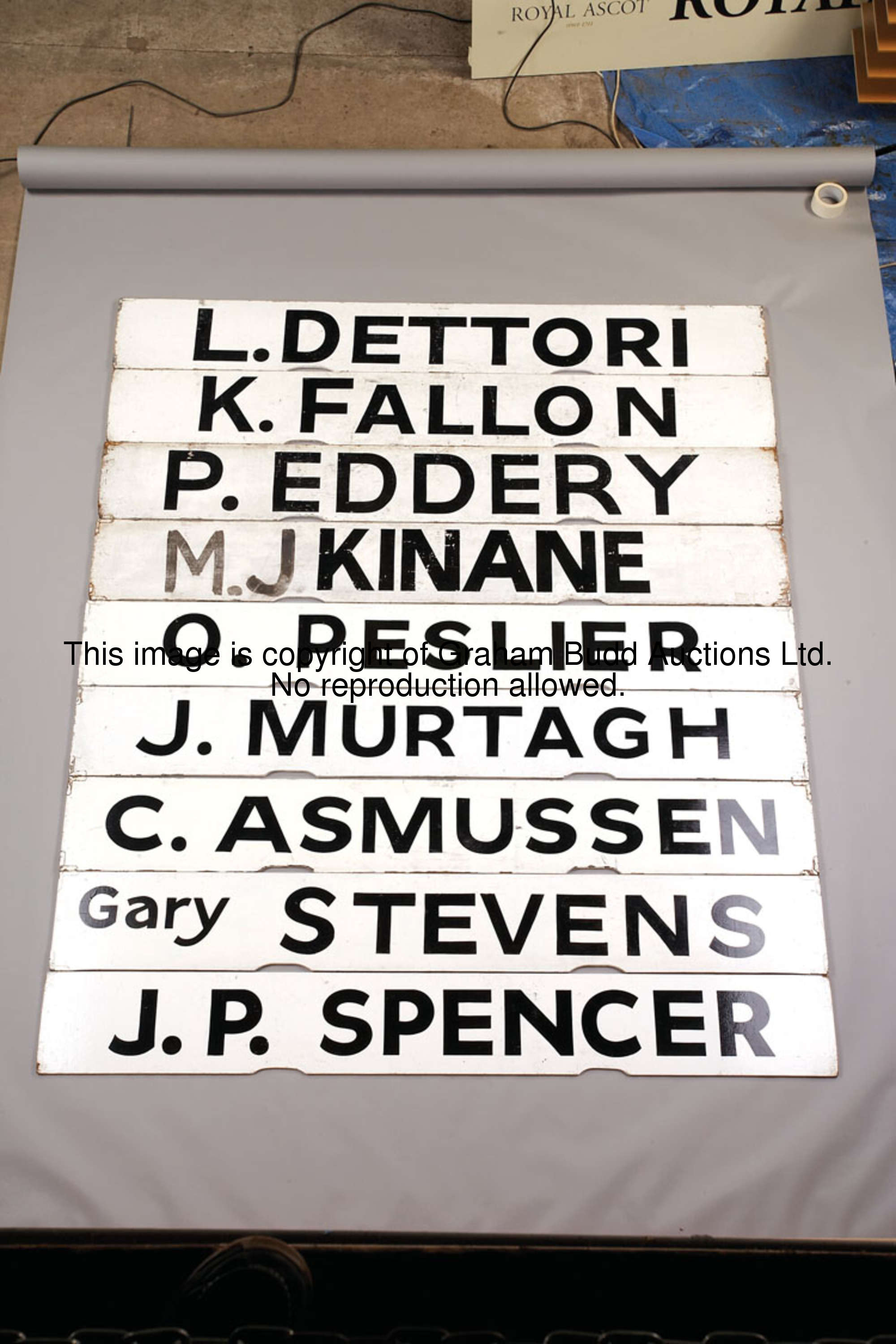 K. Fallon, white painted wooden Spagnoletti jockey board with black lettering, 25.5 by 100cm., 10 by...