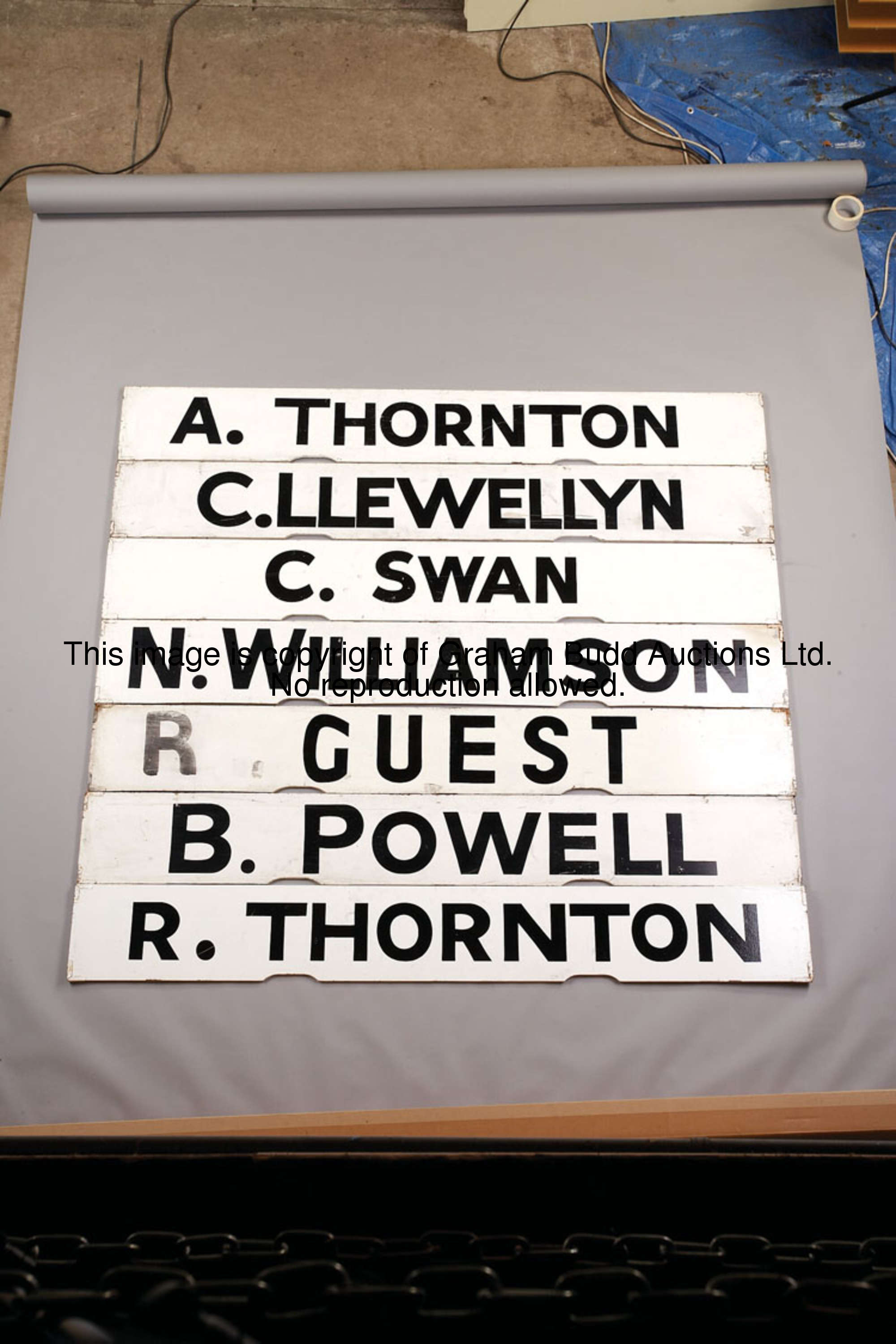 N. Williamson, white painted wooden Spagnoletti jockey board with black lettering, 25.5 by 100cm., 1...