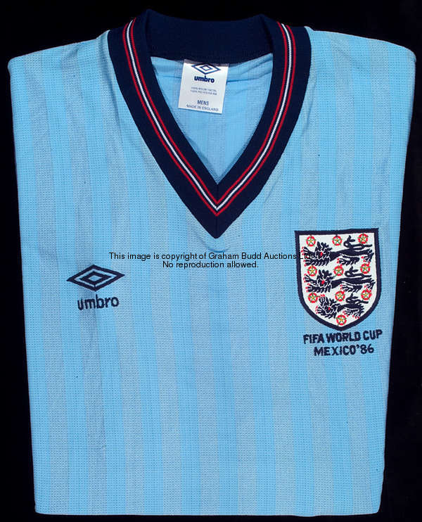 Chris Waddle: a light blue England No.11 1986 World Cup jersey, short-sleeved unworn spare, inscribe...