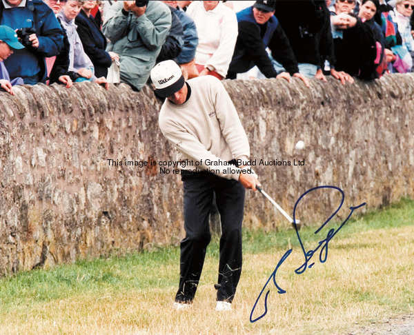 An album of 48 colour press photographs of golfers, including 4 signed examples, Ernie Els, Bernard ...