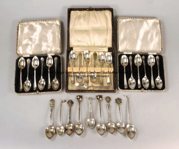 A collection of hallmarked silver spoons, comprising three half-dozen sets issued by Churchman Cigar...