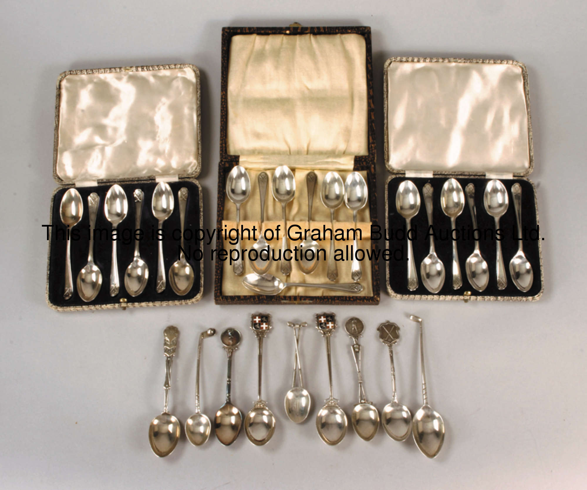 A collection of hallmarked silver spoons, comprising three half-dozen sets issued by Churchman Cigar...