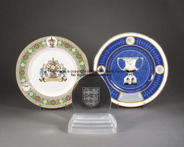 Three Football Association commemoratives, a Royal Doulton crystal plaque etched with the three lion...