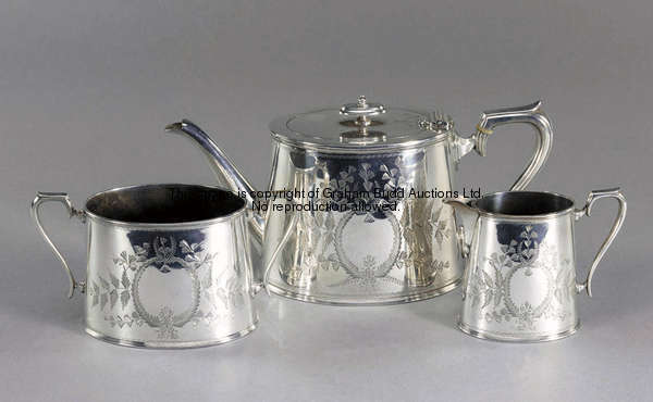 A three-piece electroplated tea service presented to Crystal Palace FC, the teapot inscribed PRESENT...