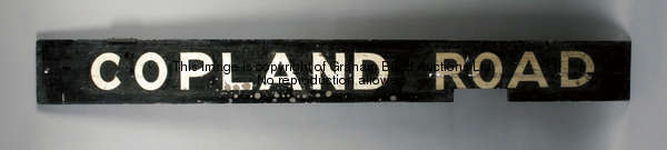 A vintage Glasgow Underground station sign for Copland Road, the painted black wooden board with whi...