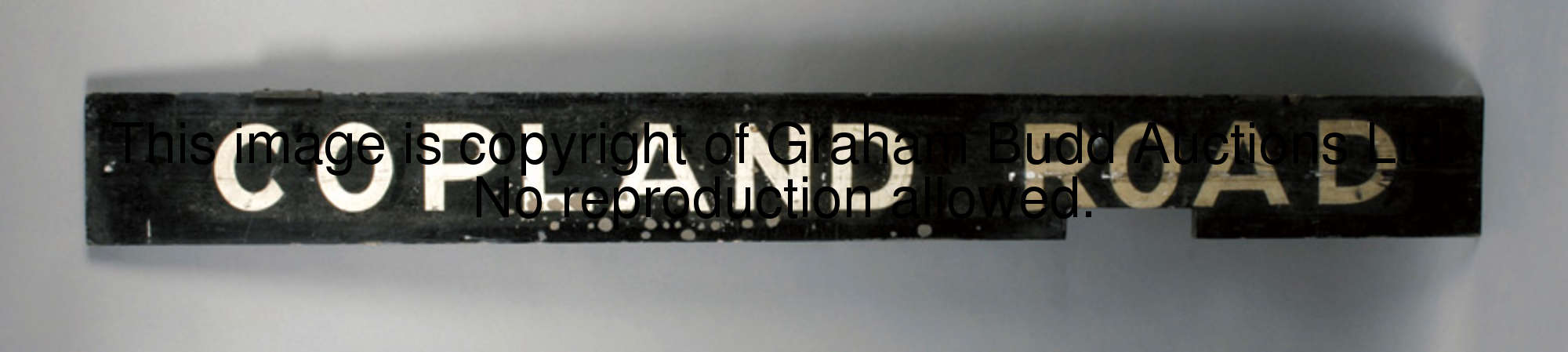 A vintage Glasgow Underground station sign for Copland Road, the painted black wooden board with whi...