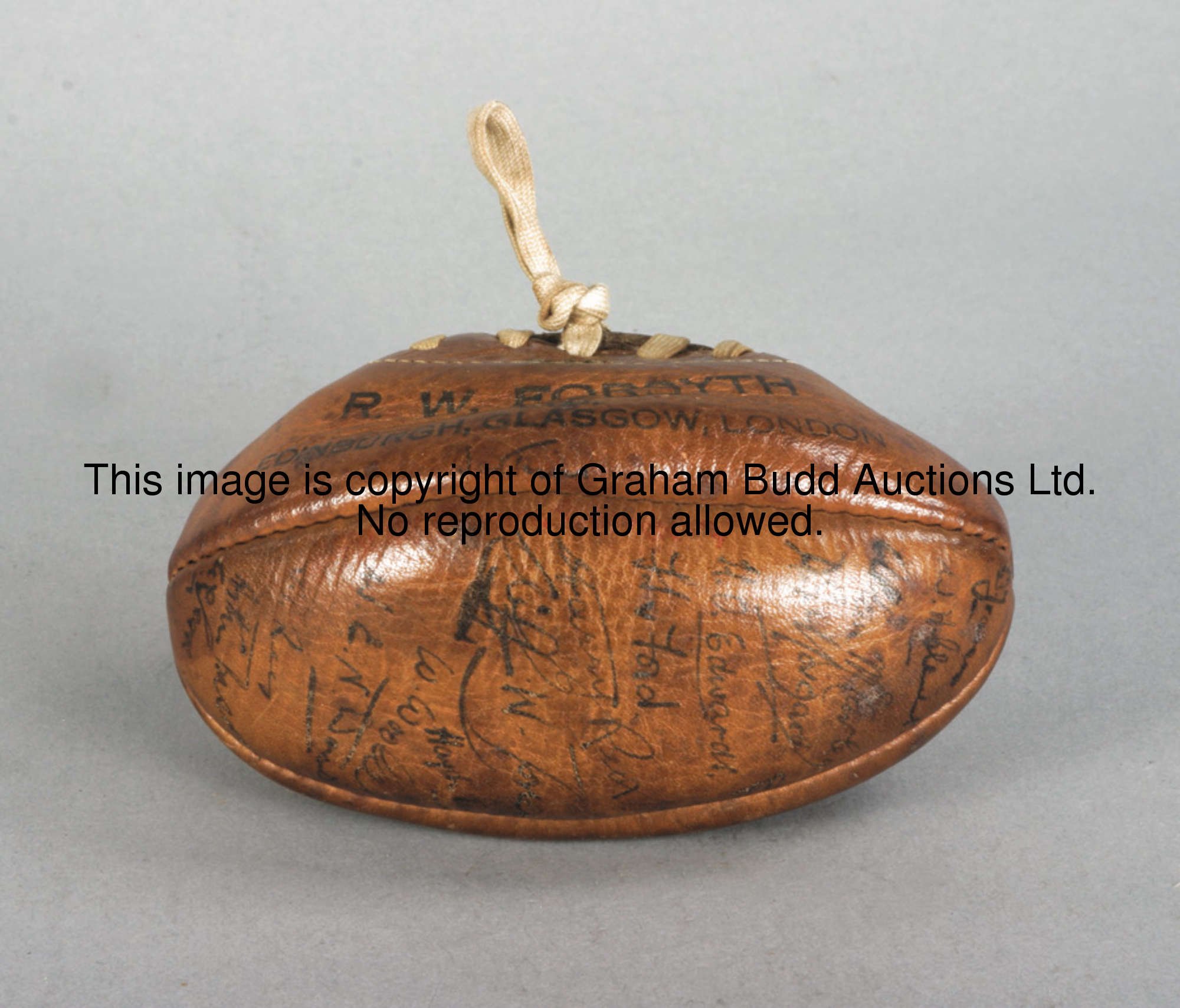 Rugby Football: a miniature leather rugby ball signed by the Welsh international XV v Scotland in 19...